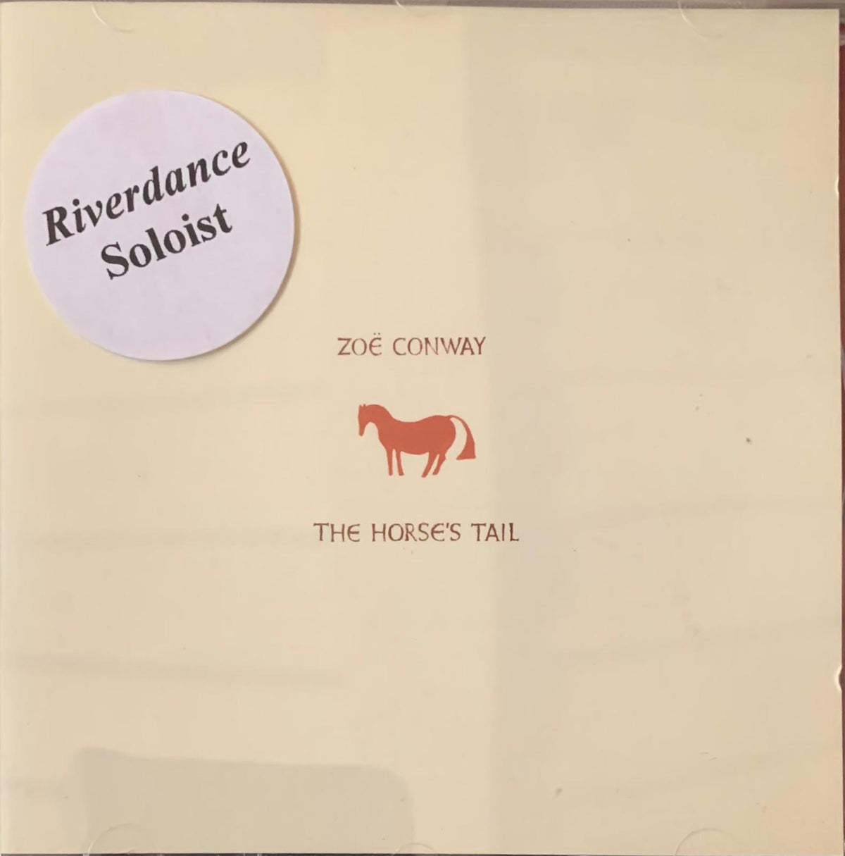 Cream vinyl record sleeve with minimalist orange horse silhouette and the title the horses tail by zoë conway
