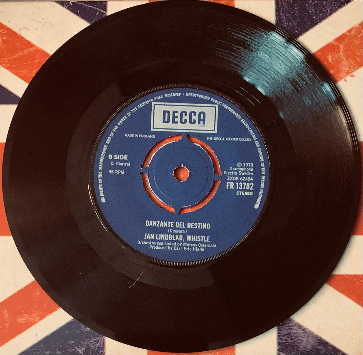 Black vinyl record with blue label and orange design by decca records released in 1978 jan lindblad whistle 45t vinyl