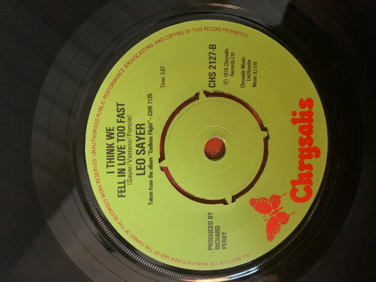 Yellow vinyl record label with red text and butterfly logo featuring leo sayer i think we fell in love too fast song