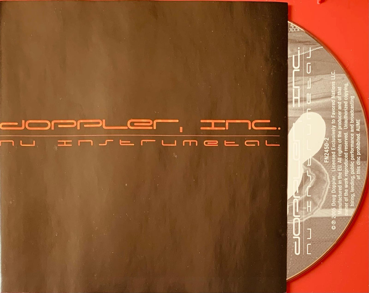 Brown cd case with orange text doppler inc and nu instrumental partially open showing red cd inside for doppler inc original cd