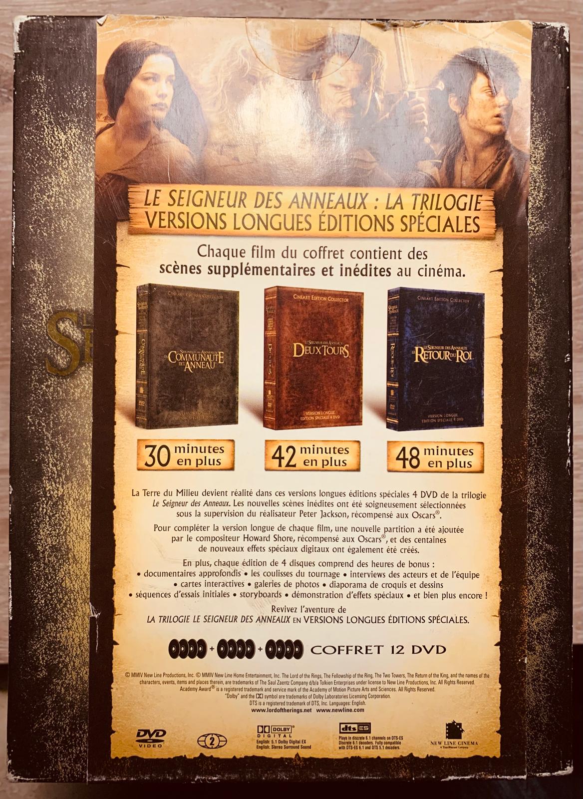 The back cover of the le seigneur des anneaux 12-dvd box set featuring three colorful book-style cases in french text