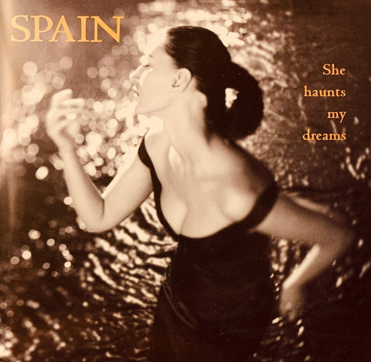 Sepia-toned album cover for various artists Spain she haunts my dreams featuring a woman in a black dress