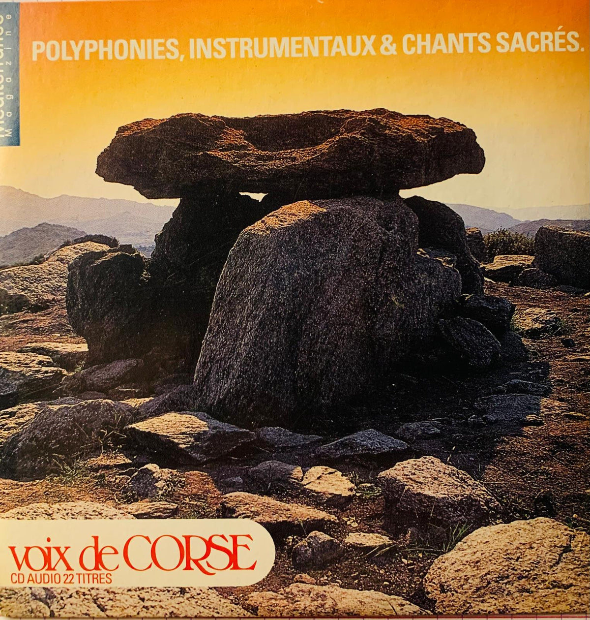 The album cover of various artists voix de corse cd features a dark weathered stone dolmen with a flat capstone