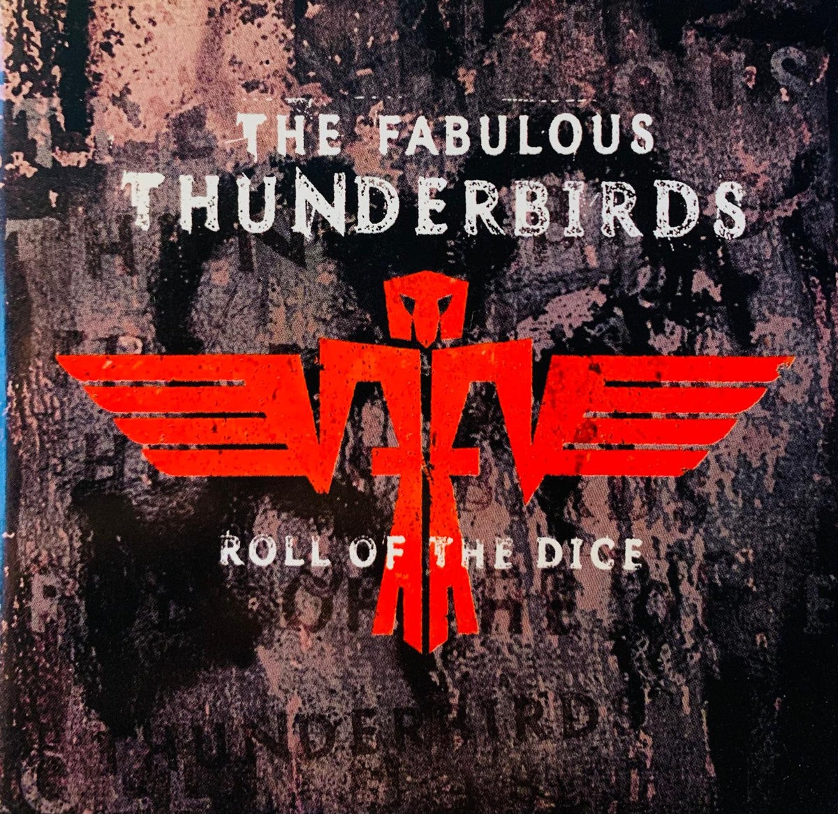 The fabulous thunderbirds roll of the dice original cd features a bold red bird logo on a textured dark background