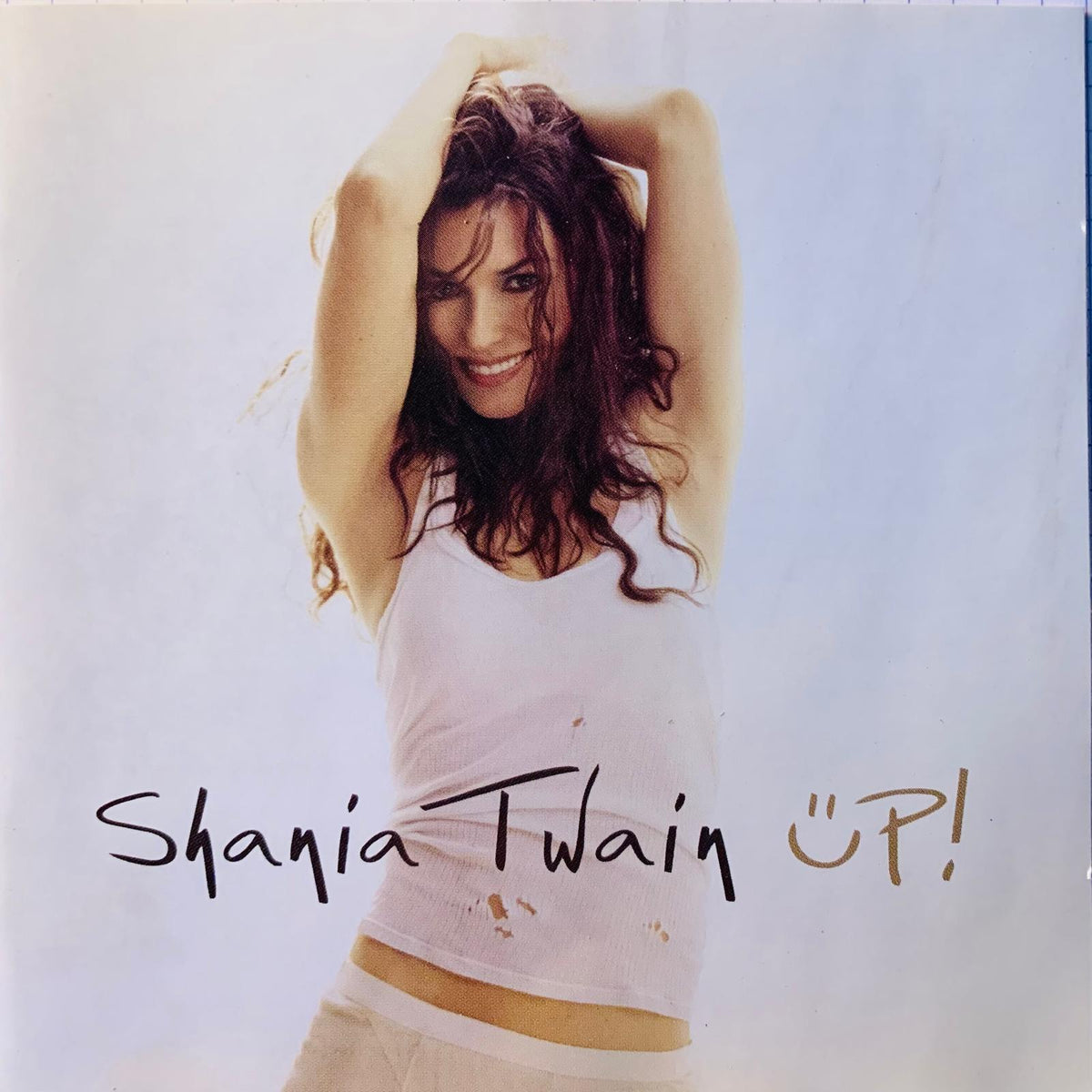 Canadian shania twain up original cd album cover featuring white tank top with subtle stains and light-colored pants