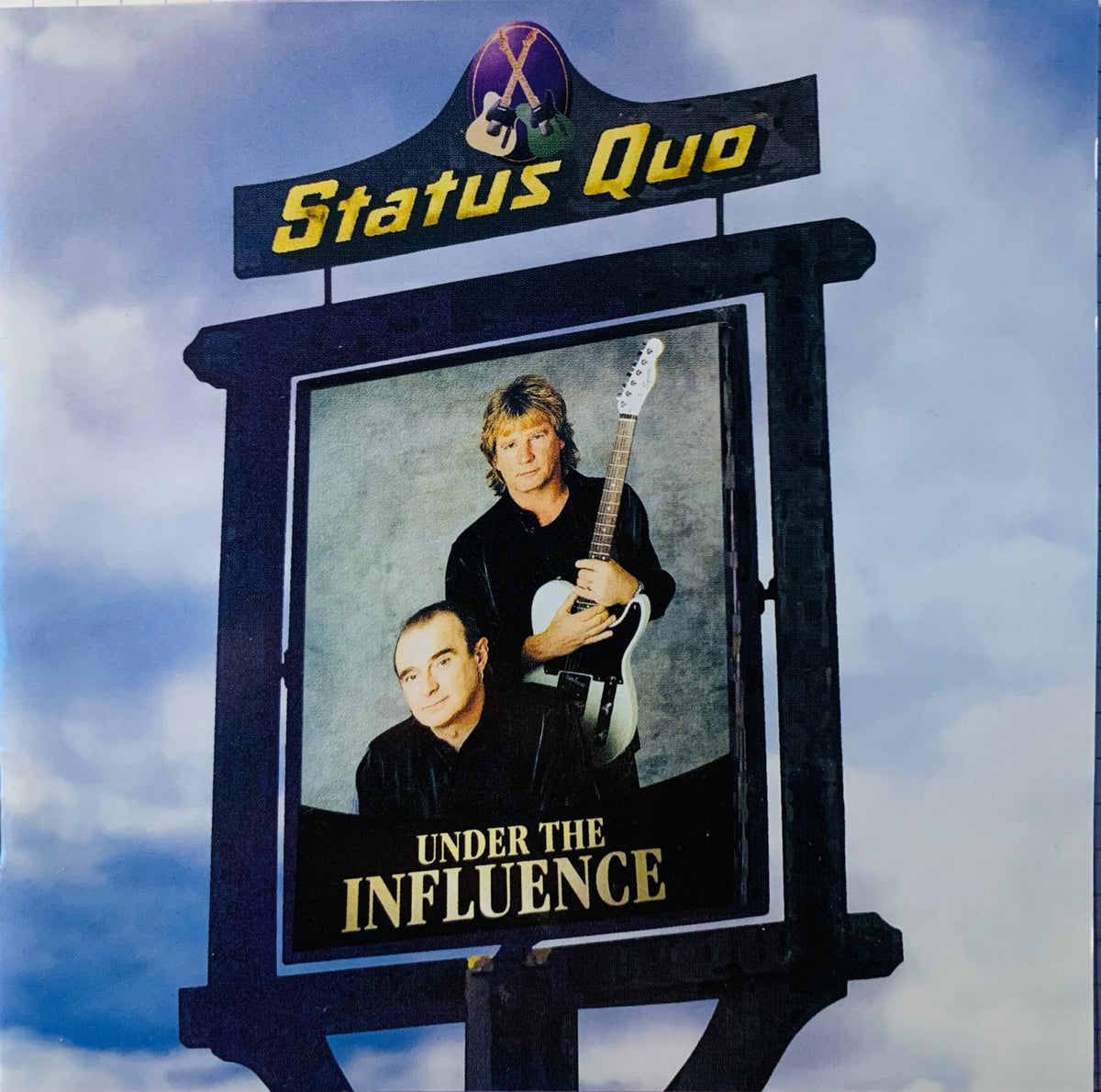 Black wooden sign featuring status quo band photo and under the influence album title in gold lettering for cd display