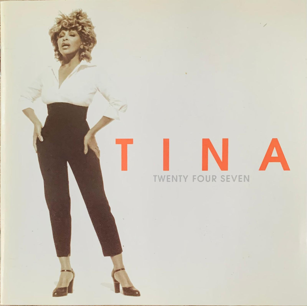 Tina Turner Twenty Four Seven original CD featuring a black-and-white cover photo of Tina in white blouse and dark pants