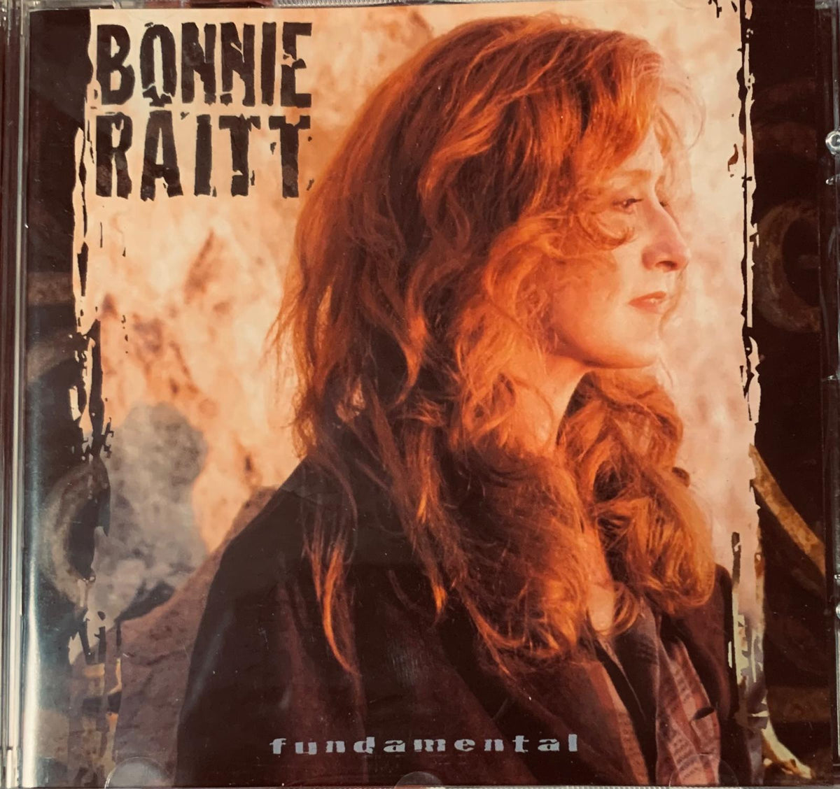 Bonnie raitt fundamental 1998 original cd album cover featuring the artist with long red hair and dark clothing