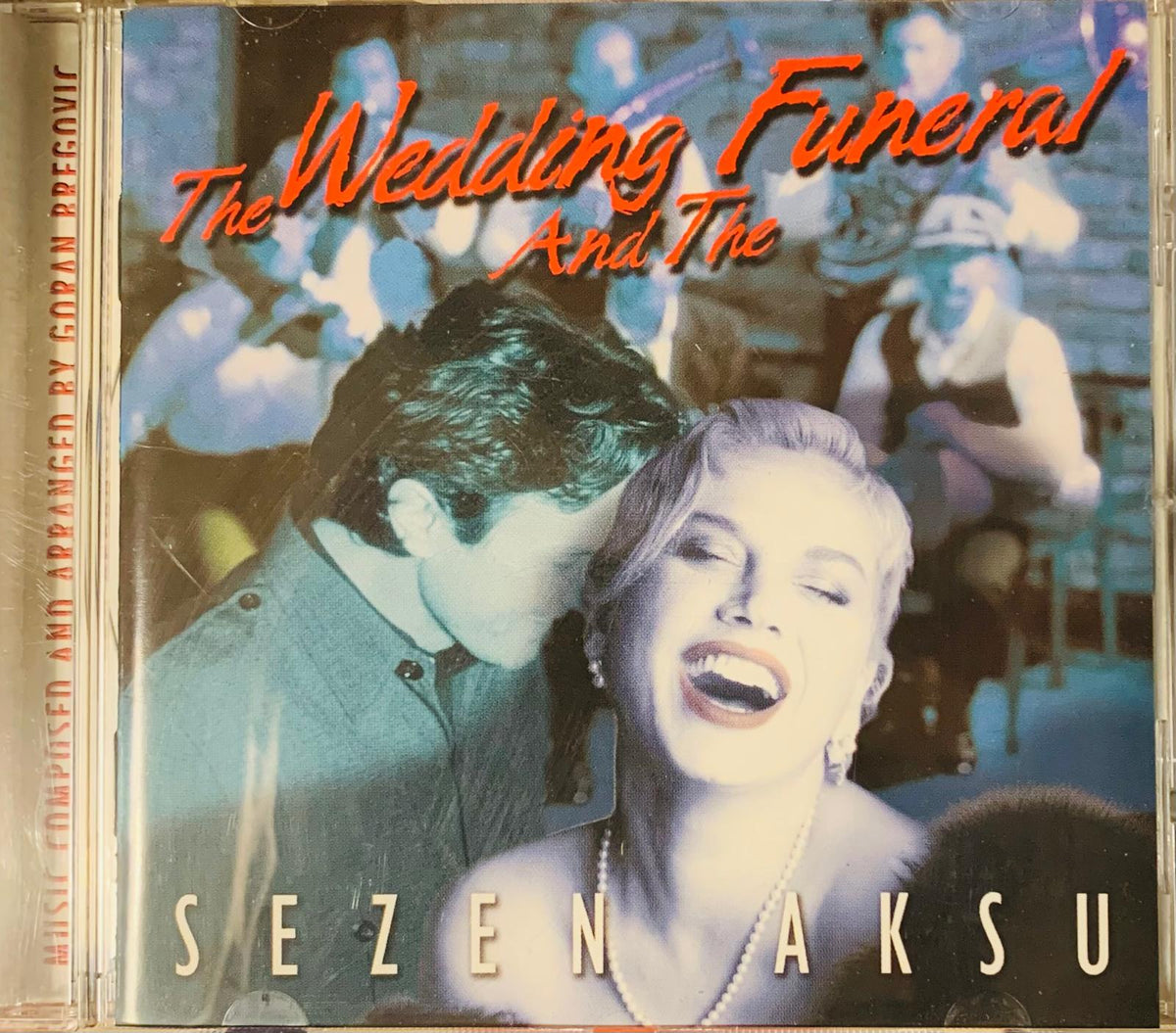 Sezen aksu düğün ve cenaze cd album cover with stylized man and woman in blue tones and blurred background figures