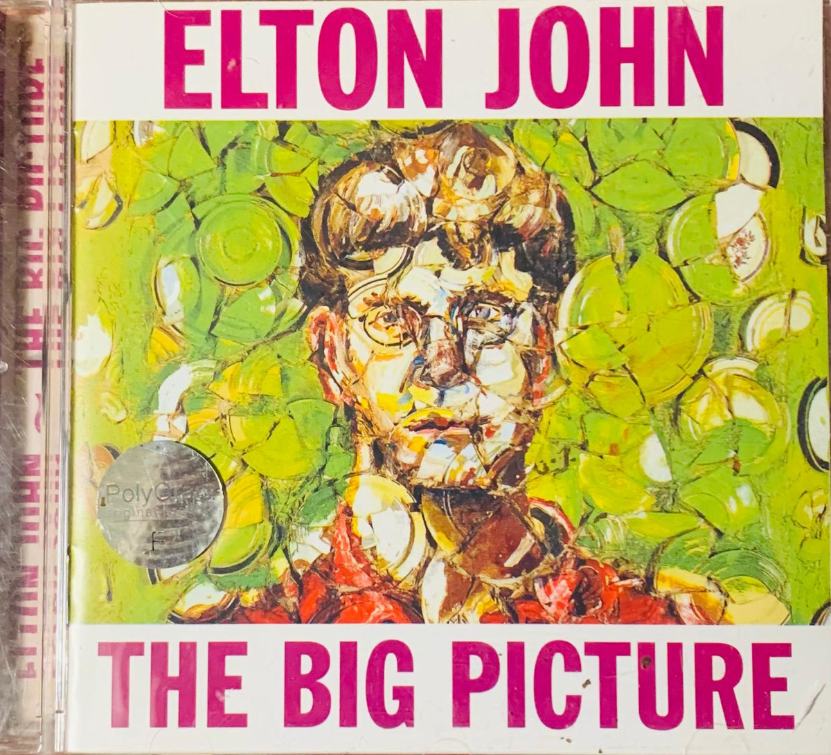 Elton john the big picture 1997 original cd album cover with mosaic portrait in green and yellow tones on vibrant background