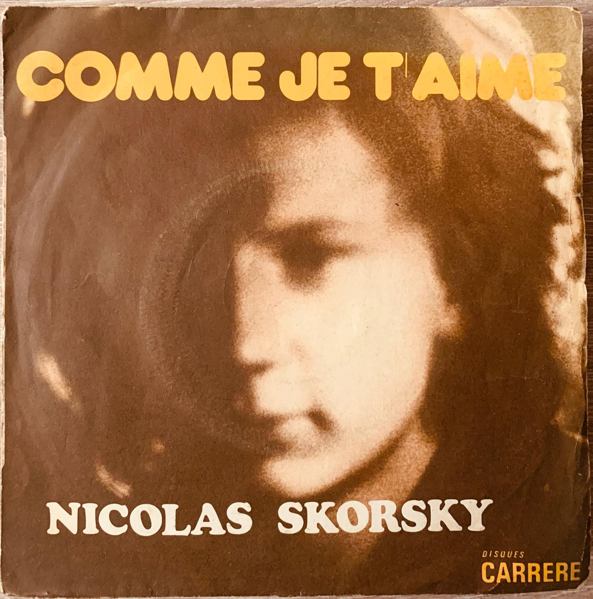 Vintage sepia vinyl record sleeve for nicolas skorsky comme je taime with stylized portrait and bold yellow lettering