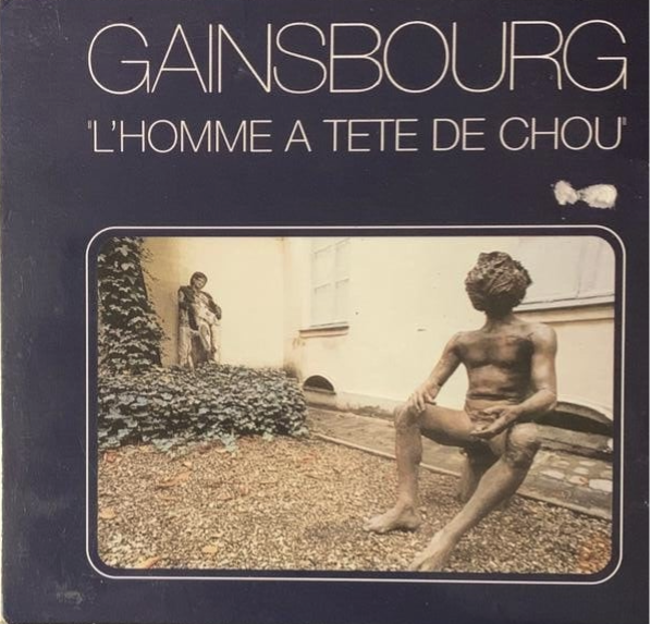 Serge Gainsbourg CD album cover with sepia photo of two bronze statues in an outdoor garden setting