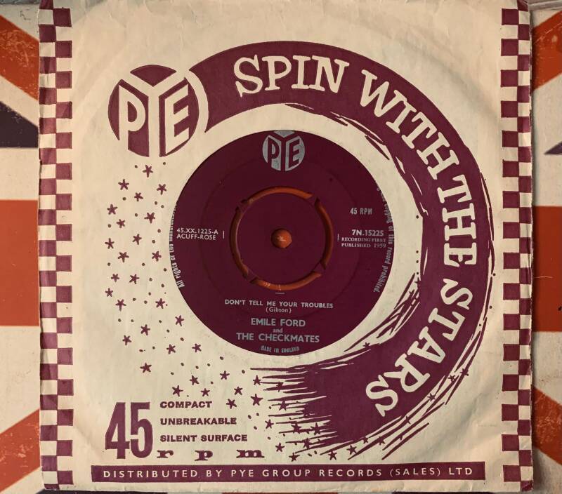 Maroon and white vinyl record sleeve with checkered border and bold spin with the stars title for emile ford 7 inch vinyl