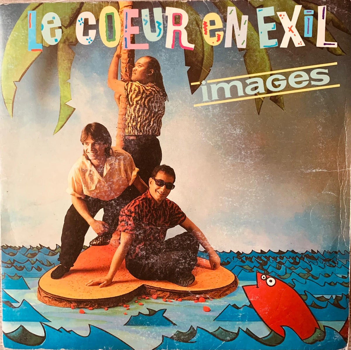 Vibrant illustrated album cover for le coeur en exil vinyl featuring three people on heart platform with palm trees and waves