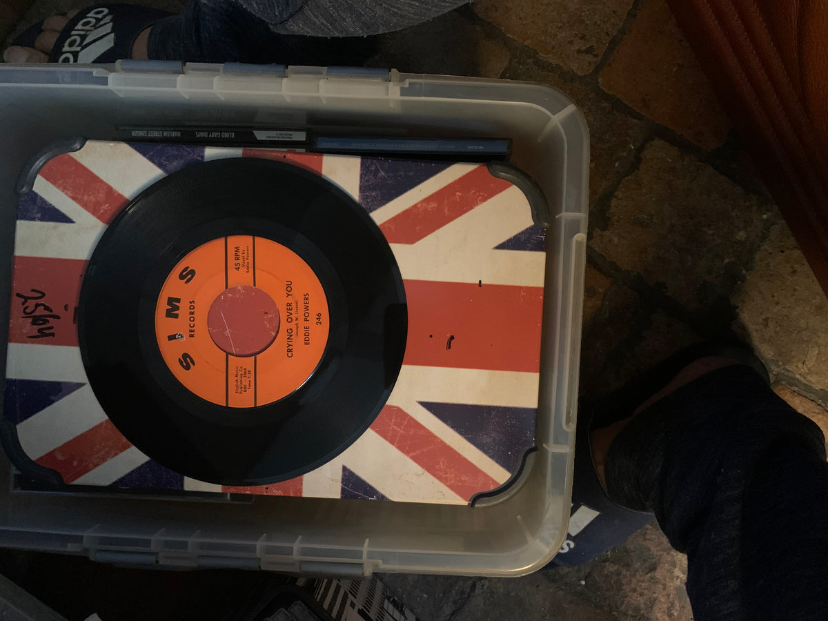 Black vinyl record with orange label featuring crying over you by scott powers pressed on union jack surface soul 7