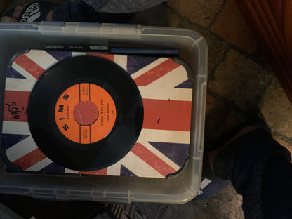 Black vinyl record with orange label featuring crying over you by scott powers pressed on union jack surface soul 7
