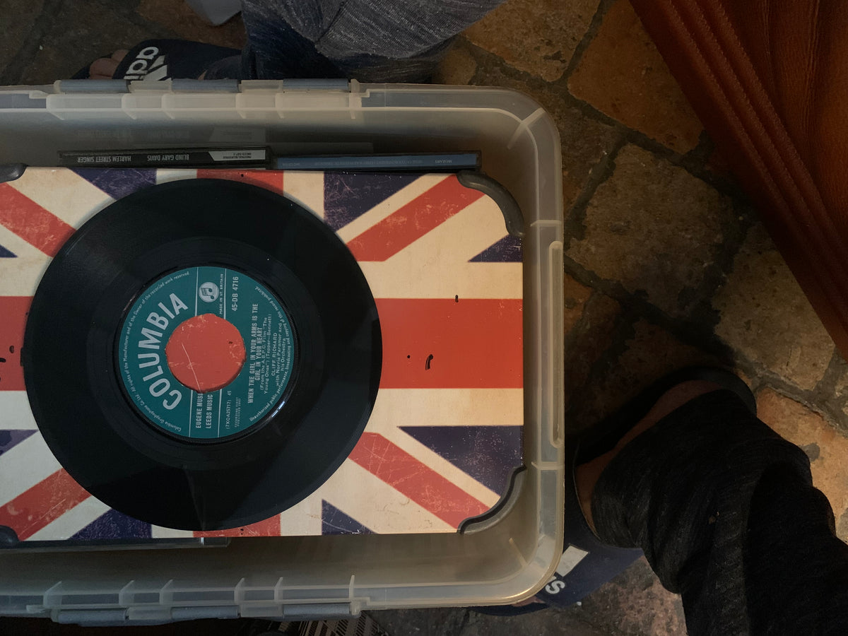 Black vinyl record with teal and red columbia label on union jack surface from soul 7 inch product