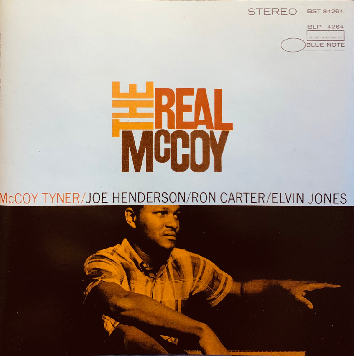 Cd 001 album cover featuring bold orange and brown typography over a sepia photo of a jazz musician in a plaid shirt