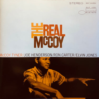 Cd 001 album cover featuring bold orange and brown typography over a sepia photo of a jazz musician in a plaid shirt