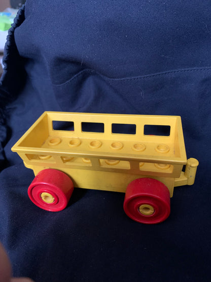 Yellow plastic toy wagon with red wheels and rectangular open-top design for kids in Toys 001 collection