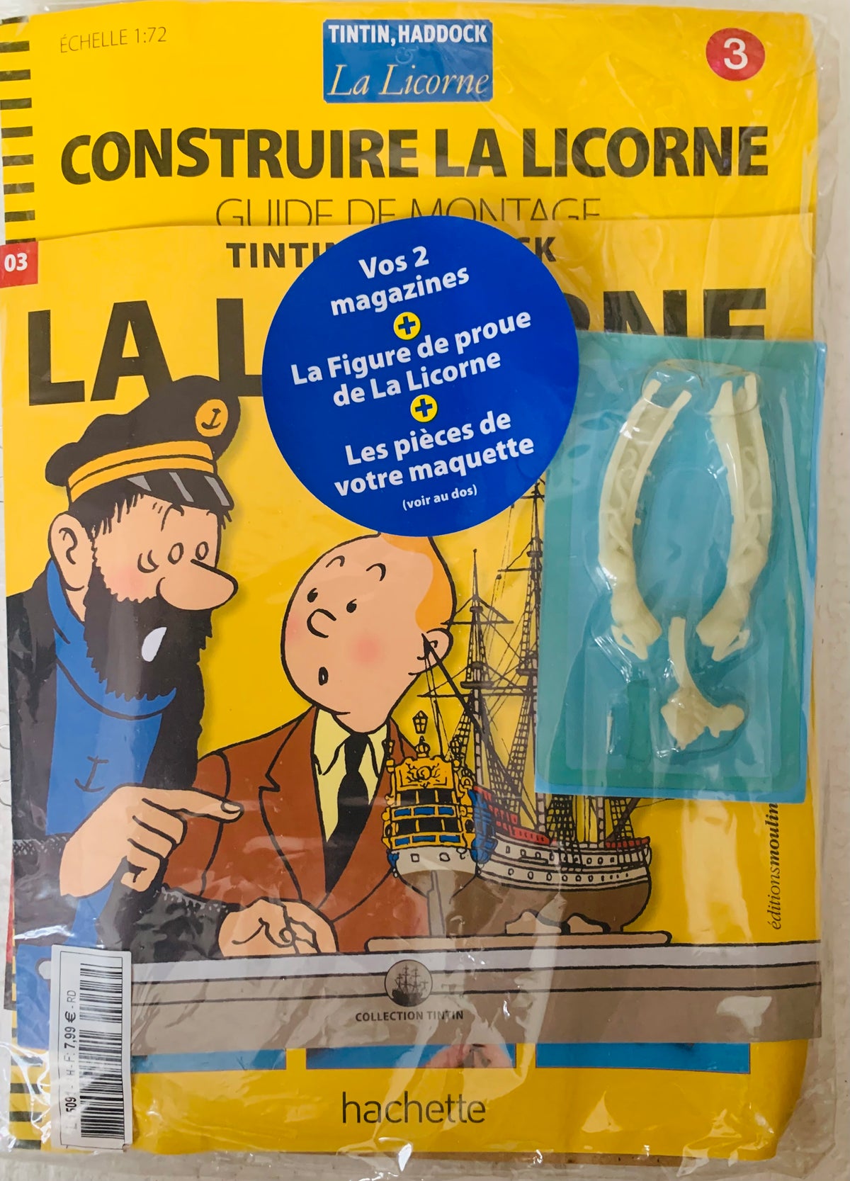 Yellow packaging for tintin and haddock la licorne model kit with two magazines and assembly pieces for display
