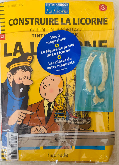 Yellow packaging for tintin and haddock la licorne model kit with two magazines and assembly pieces for display