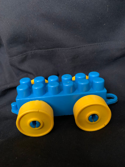 Blue and yellow plastic toy wagon with rounded wheels designed for kids in toys 001 collection