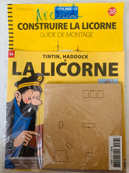 Yellow cardboard model kit packaging of tintin and haddock la licorne ship construction guide for la licorne product