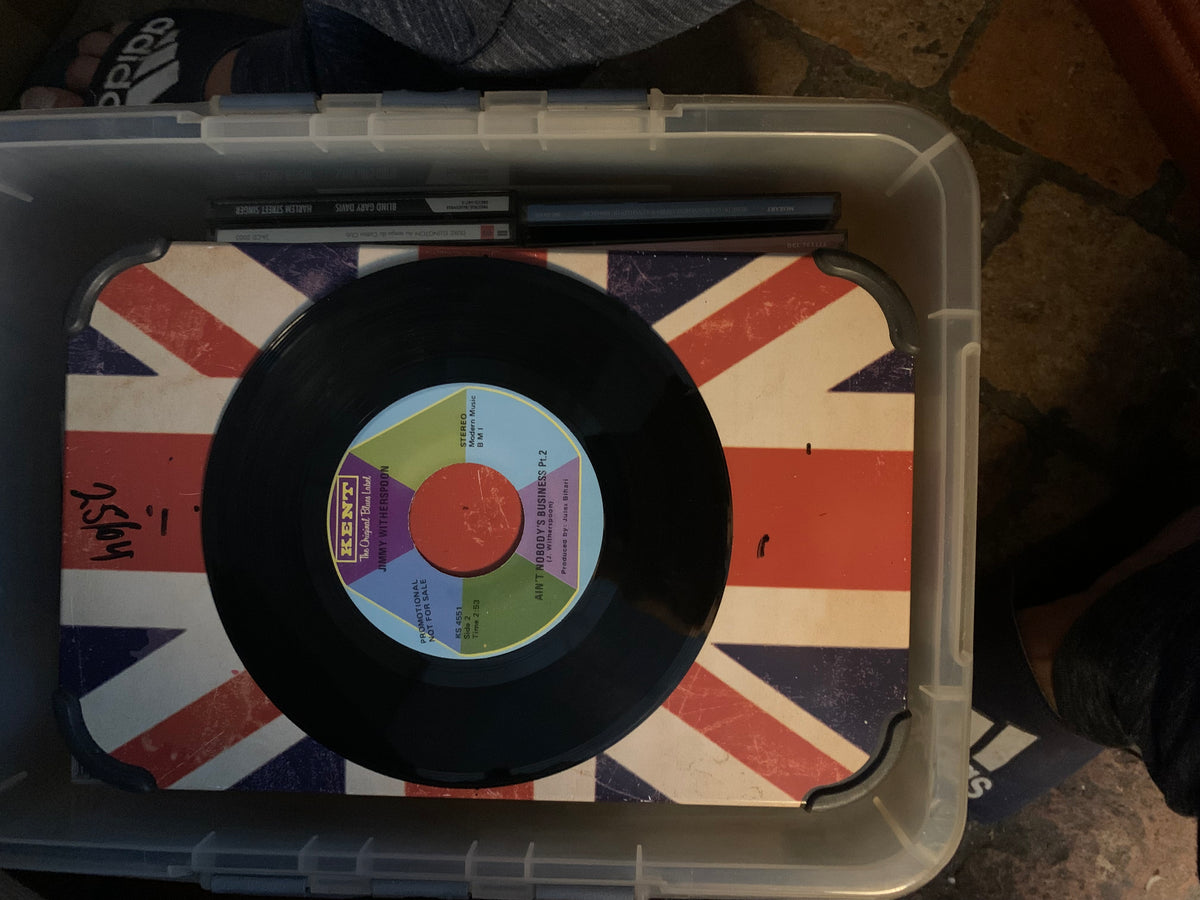 Black vinyl record soul 7 with a colorful label featuring red green and purple on an orange circle center