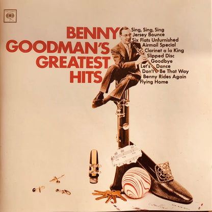 Benny Goodman sits on a tall dark wooden clarinet surrounded by musical accessories on the CD 001 greatest hits cover
