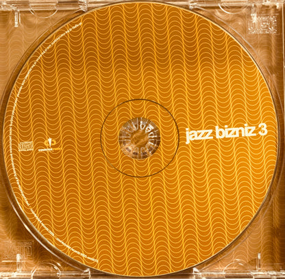 Orange cd with a wavy pattern and white text jazz bizniz 3 labeled as cd 001 product