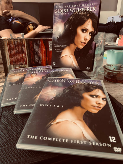 The complete first season of ghost whisperer dvd featuring jennifer love hewitt with a dark atmospheric cover