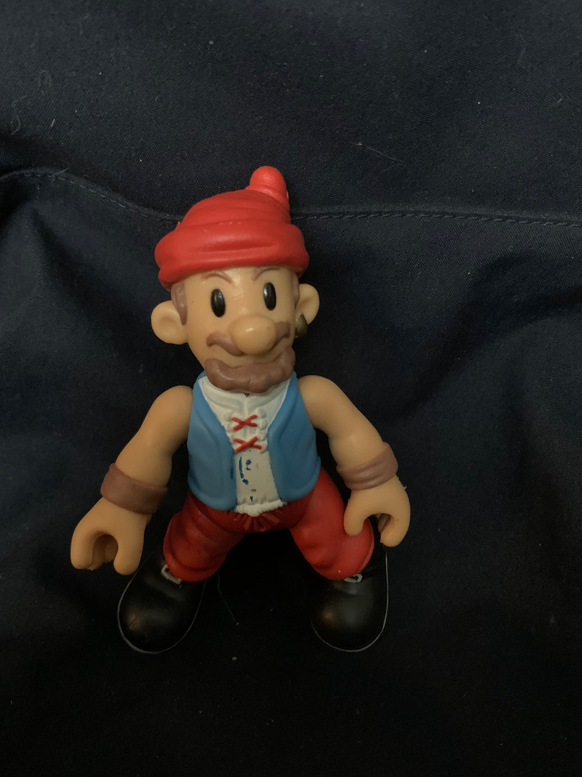 Toys 001 figurine with red cap beige skin beard blue vest white shirt red pants brown wristbands and black shoes