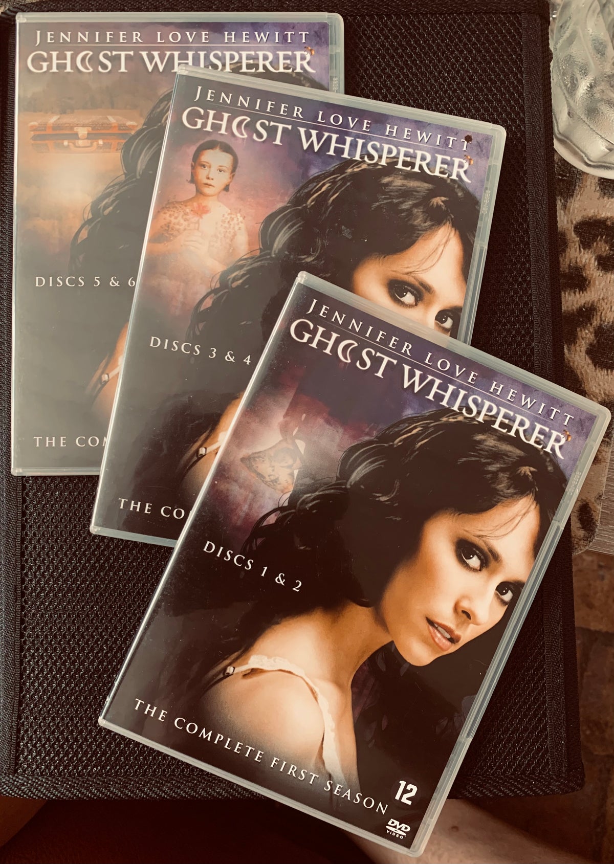 Three dvd cases for ghost whisperer featuring jennifer love hewitt labeled with disc numbers and season info in dvd 3 coffrets