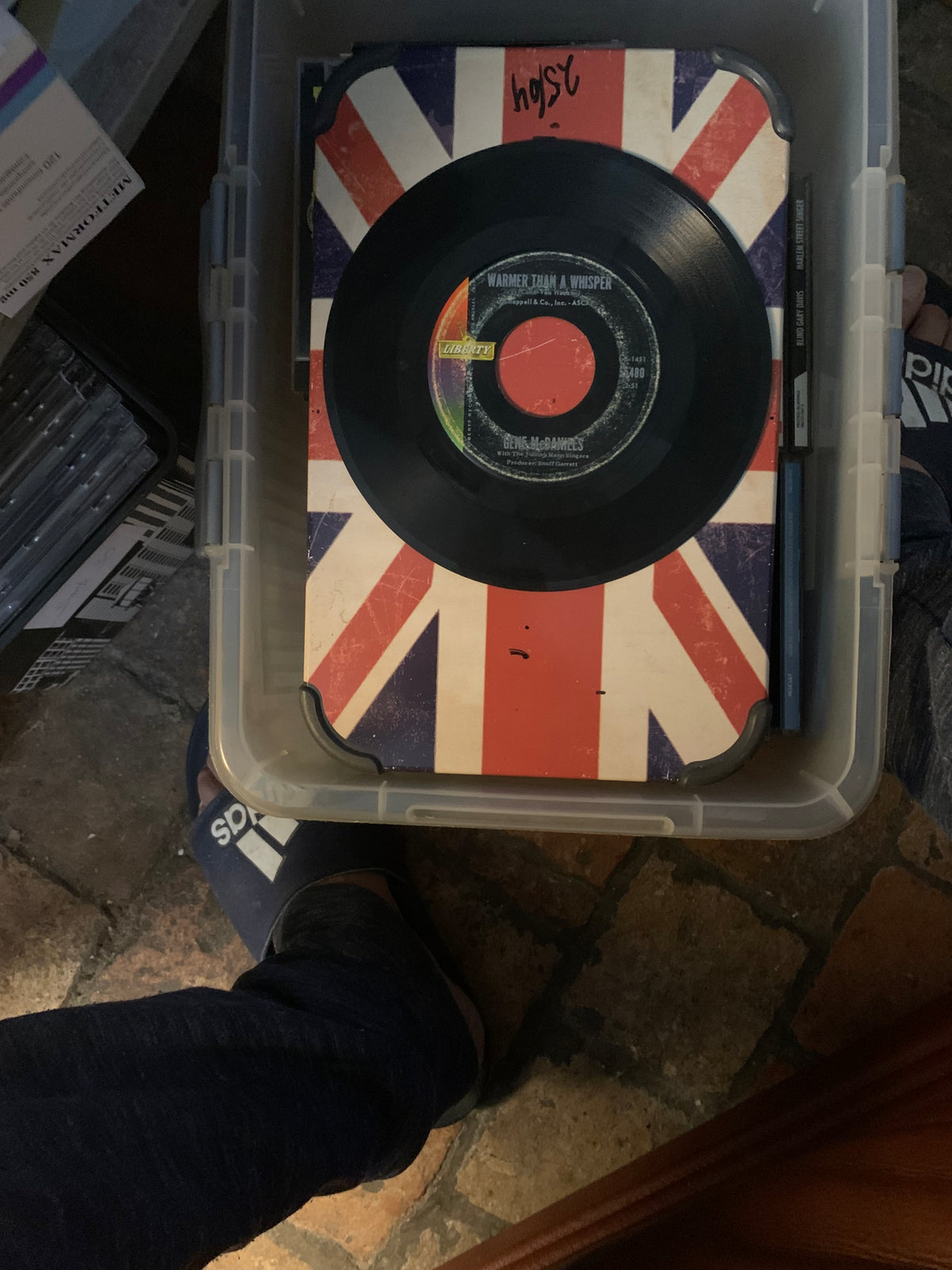 Black vinyl record with red center label on union jack sleeve for soul 7 inch music collection