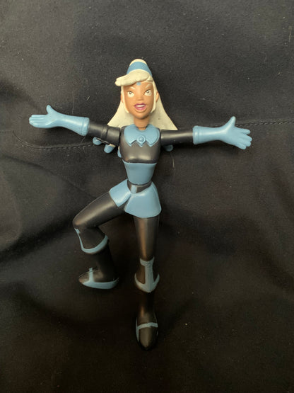 A blue and black plastic figurine of a female character with blonde hair in a futuristic outfit toys 001
