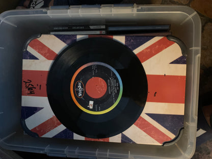 Black vinyl soul 7 inch record with colorful vee jay label for moon river on union jack surface