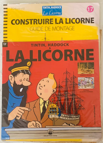 A vibrant red and yellow assembly guide booklet for the 1/72 scale model ship la licorne featuring tintin and captain haddock