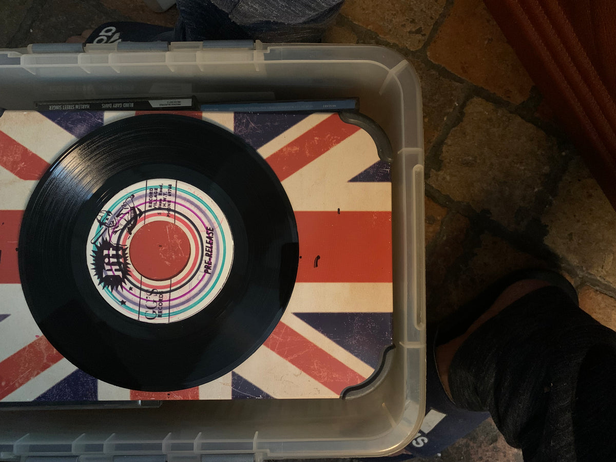 A black vinyl record titled soul 7 with a colorful circular label featuring the relapse and a cartoon character illustration