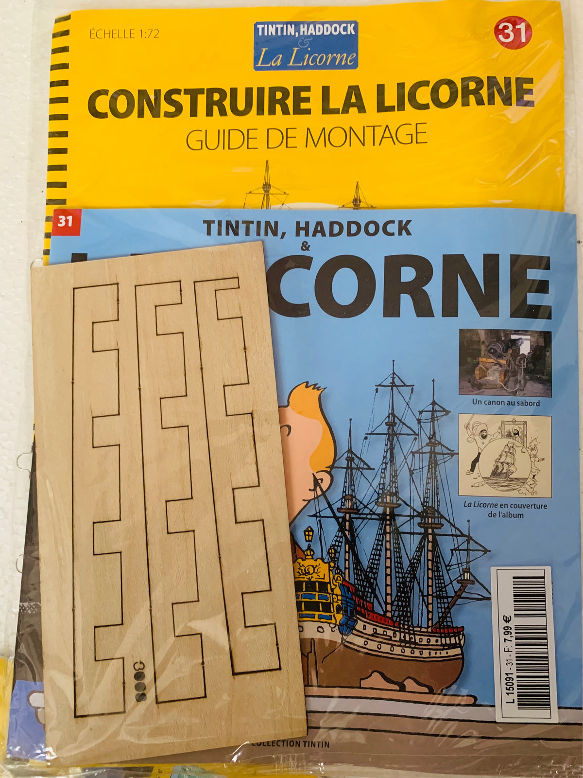 Wooden puzzle piece set in natural wood color for building the ship la licorne from tintin and haddock