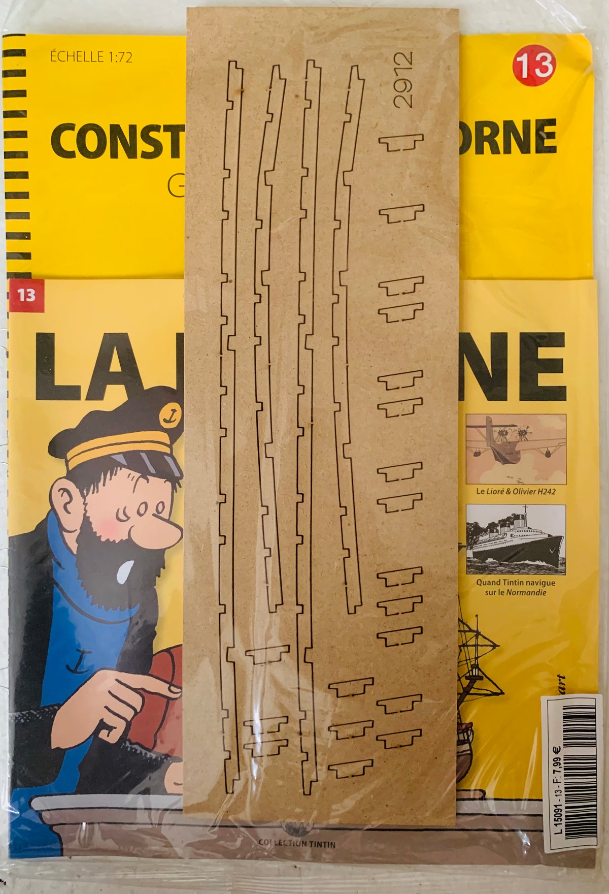 A brown laser-cut paper sheet with detailed parts for a 1 72 scale la licorne constellation model ship kit