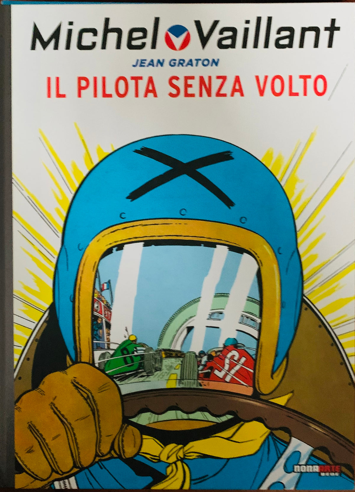 Blue racing helmet with black x mark and yellow visor trim from bd mix featured on comic book cover illustration
