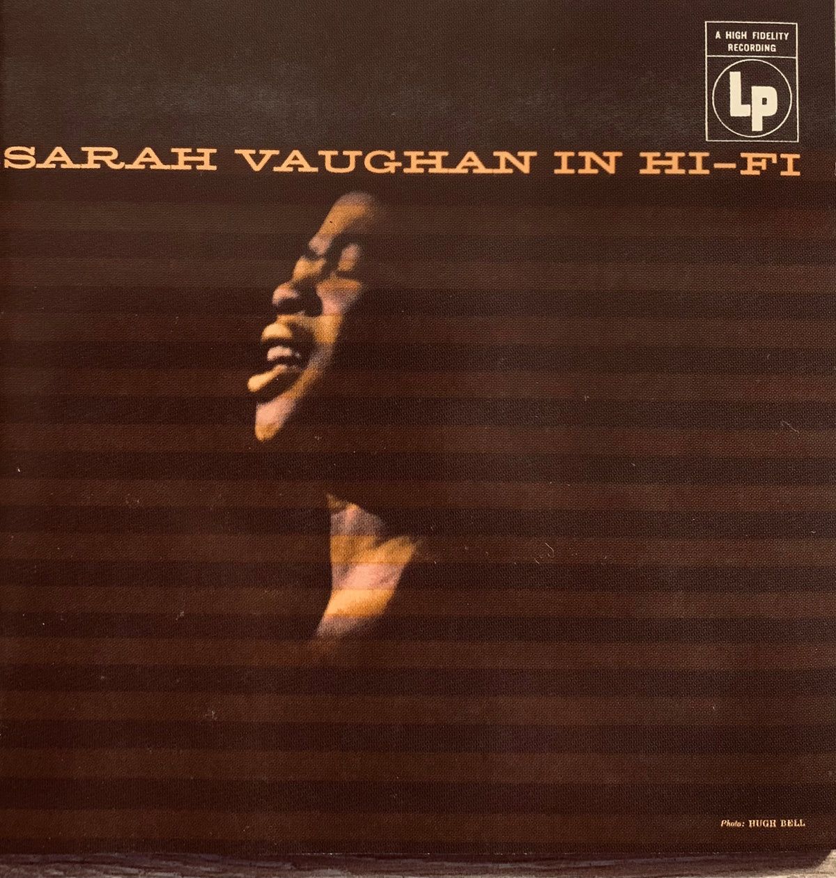 Brown vinyl record album cover featuring a stylized portrait of sarah vaughan with warm lighting and striped background cd 001