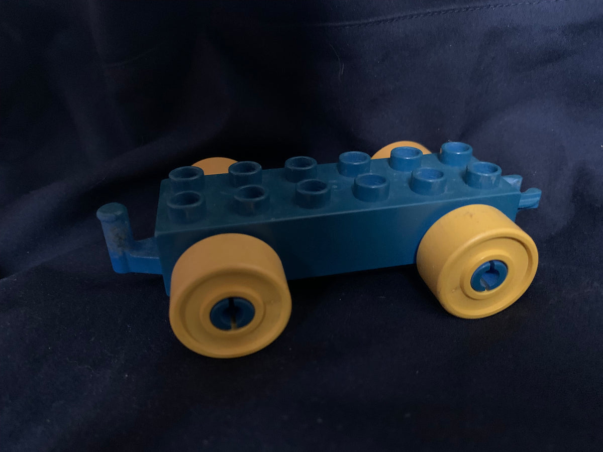 Blue and yellow plastic toy car with round wheels from toys 001 for imaginative play