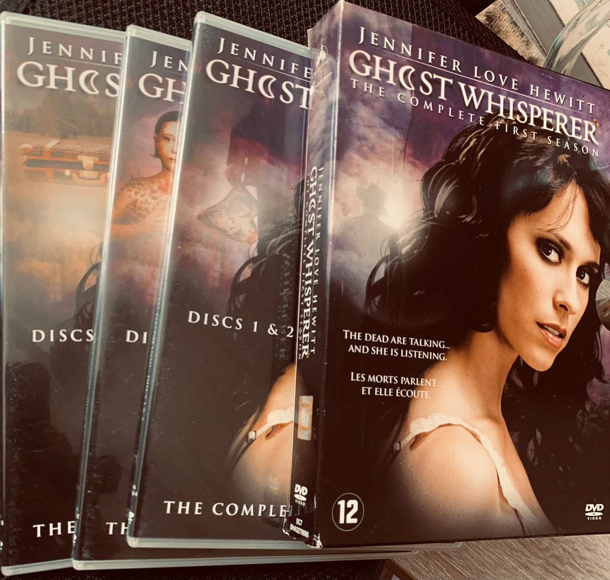 The complete first season of ghost whisperer dvd featuring jennifer love hewitt with dark moody cover design