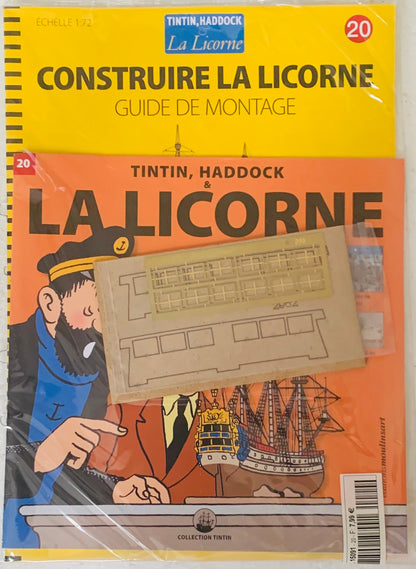 A yellow and orange tintin and haddock la licorne model kit guide with printed instructions and character illustrations