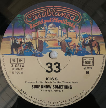 Casablanca records 1979 vinyl record of KISS song sure know something with a colorful desert scene illustrated label