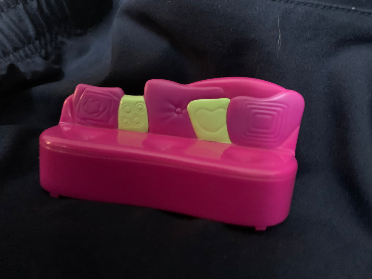 Pink plastic toy sofa with lime green decorative cushions from toys 001 for children’s playroom use
