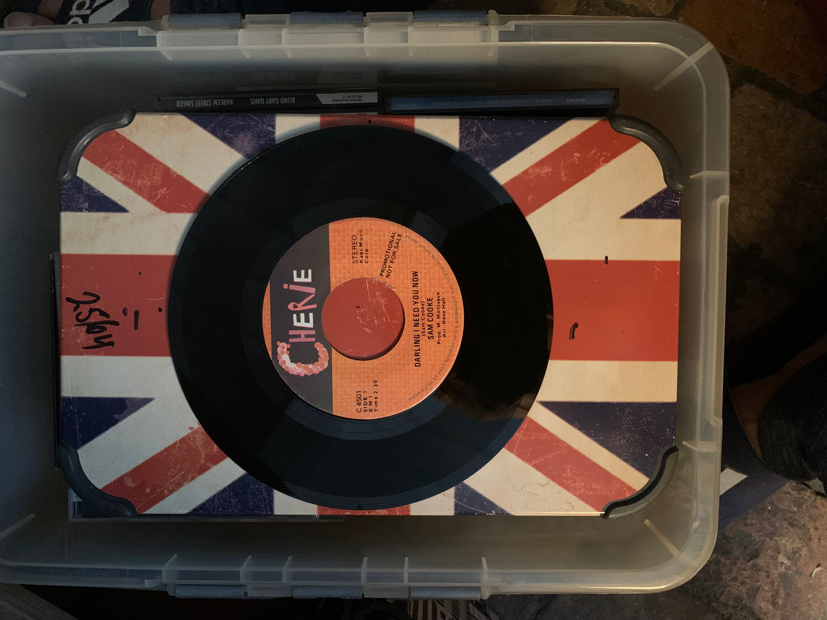 Black vinyl record with orange label featuring cherie darling im yours resting on union jack surface soul 7 product
