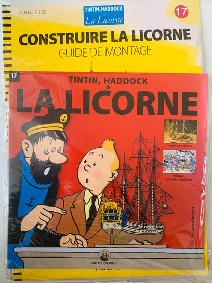 Yellow and red booklet titled construire la licorne featuring tintin haddock and detailed illustration of the ship la licorne